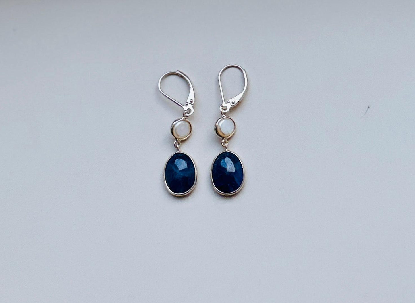 Blue sapphire and pearl hanging earrings minimal everyday fine jewelry in solid gold and sterling 925 silver with natural gemstones.