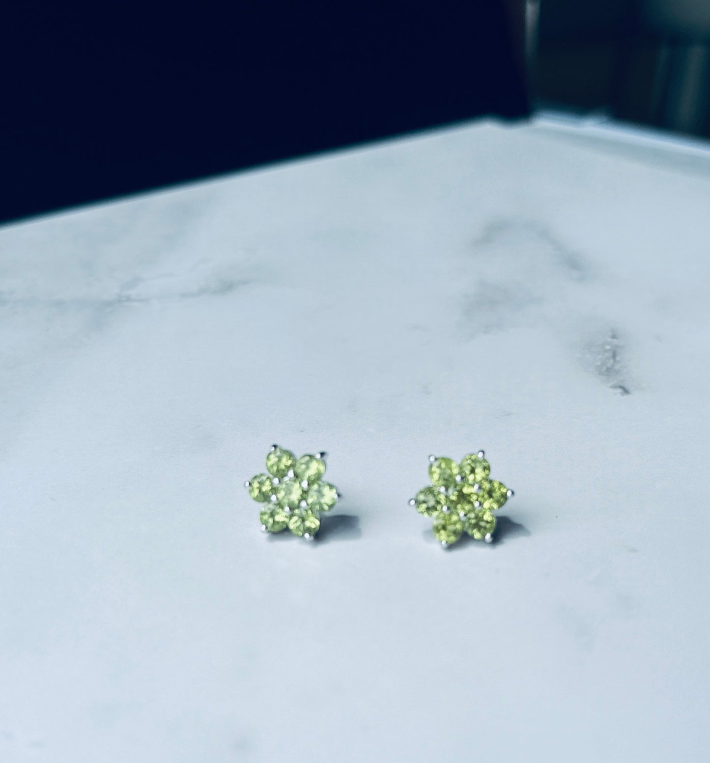 Peridot flower design in silver
