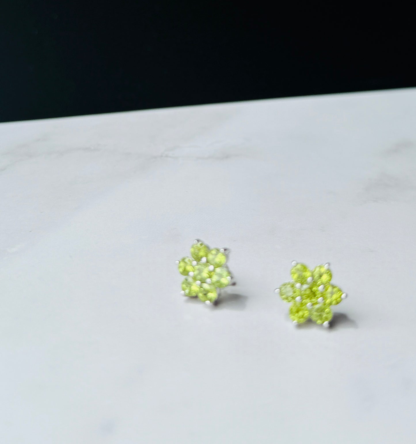 Peridot flower design in silver